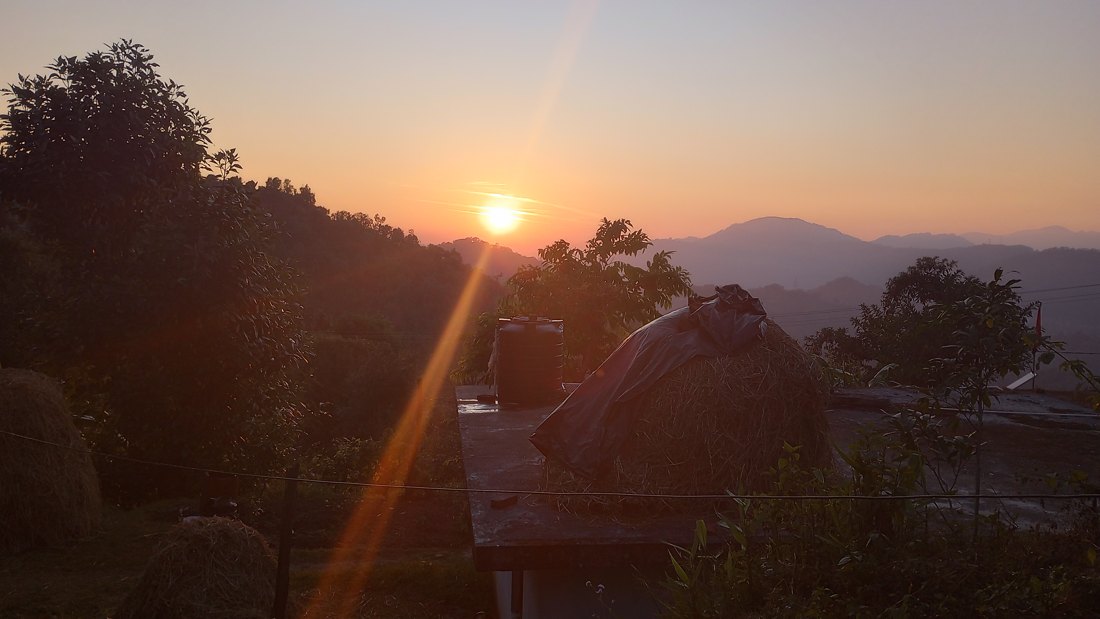 The sun setting over the hills at Shyamla Tal